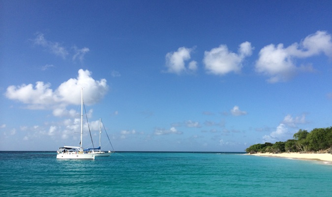 A fancy boat floating near the beach of Buck Island in the Virgin Islands