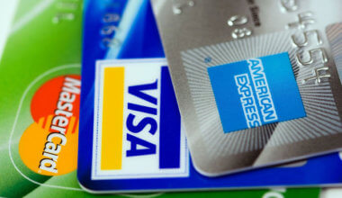an assortment of business credit cards, including a Visa, Mastercard, and American Express