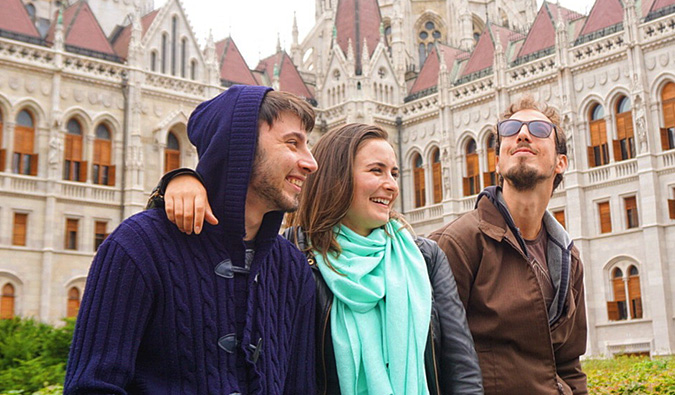 Celinne da Costa and two of her male Couchsurfing hosts posing for a photo in Europe