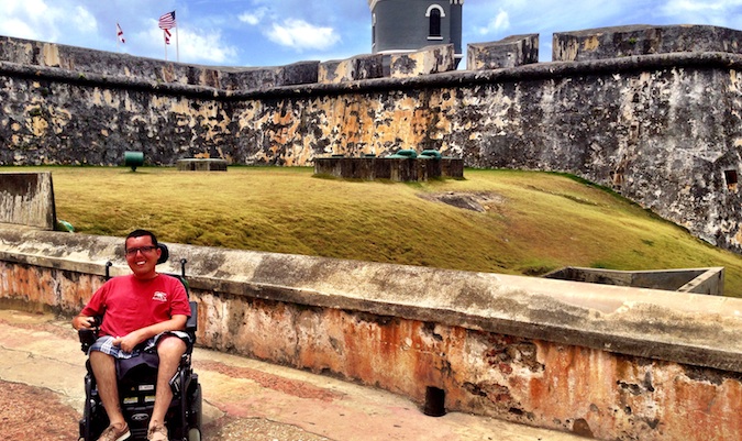 Cory Lee posing for a photo at an old historic fort