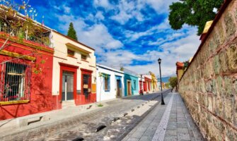 A quiet, empty street painted bright colors in beautiful Oaxaca, Mexico
