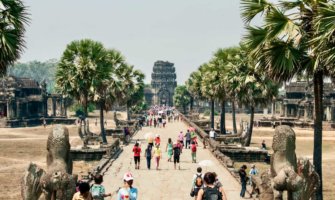 A crowd of tourists entering Angkor Wat in Cambodia