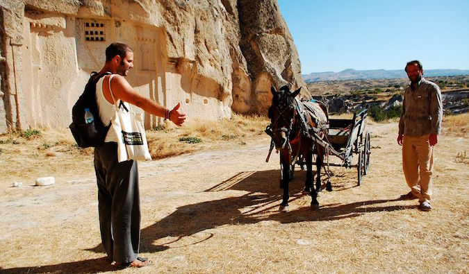 Hitchhiking a ride with a wagon and donkey in the Middle East