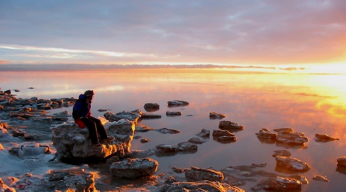 watching the sunset alone in a national park in alaska